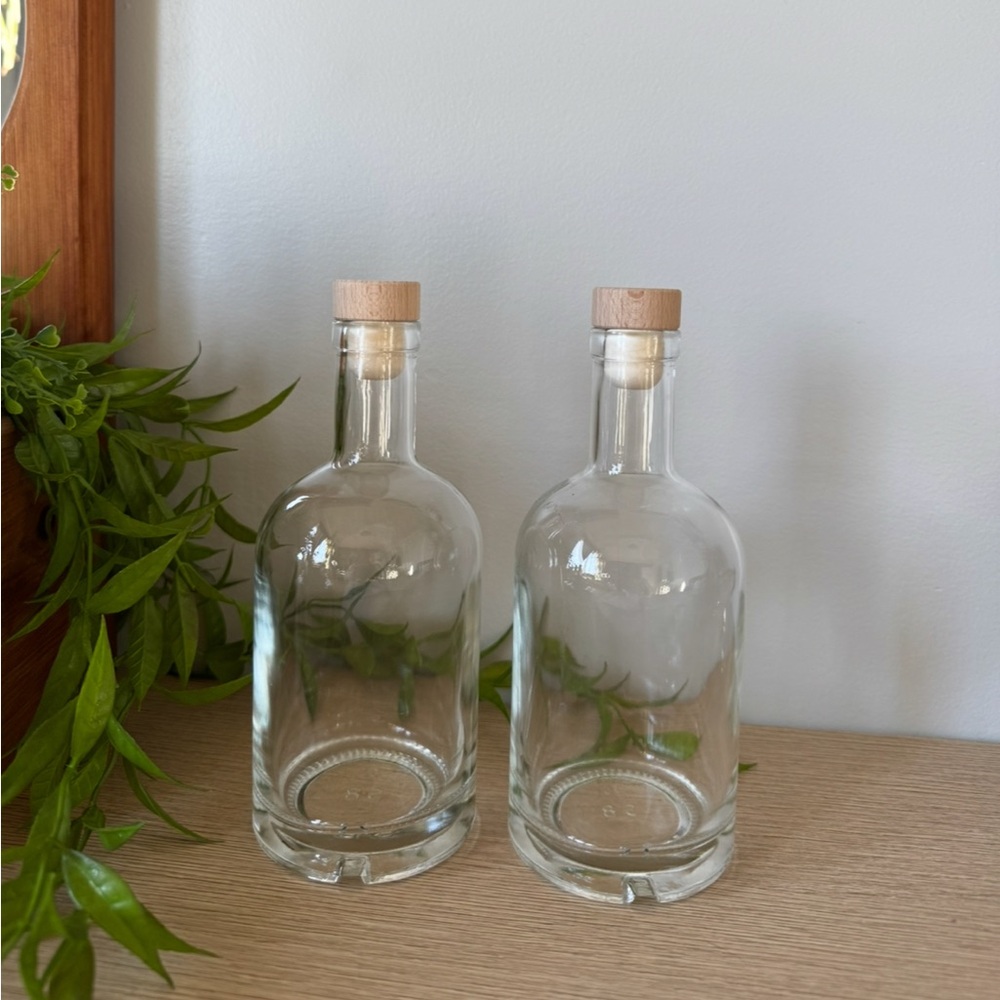 Set of Two Clear Glass Bottles with Wooden Stoppers